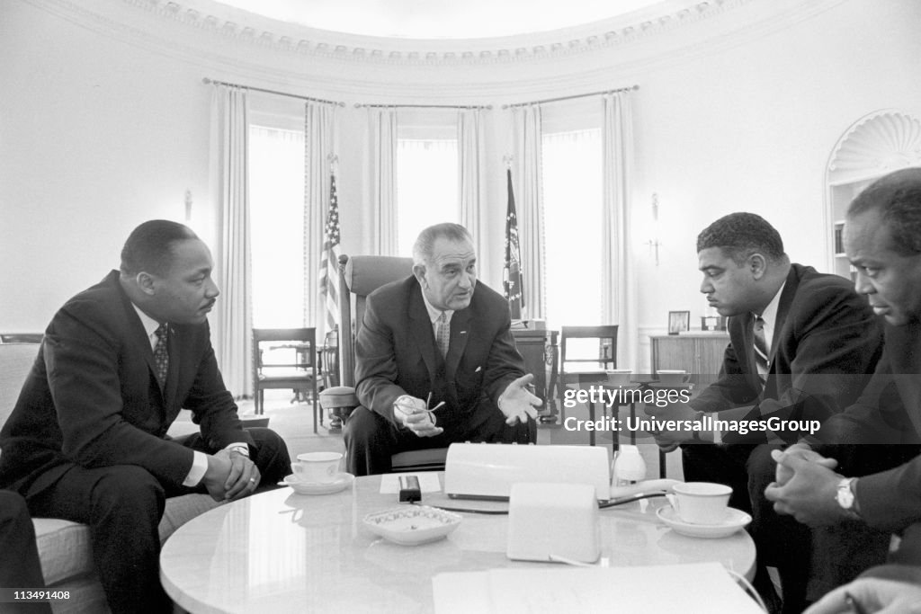 Lyndon Baines Johnson (1908-1973) 36th President of the United States in talks with Civil Rights leaders in the White House, including Martin Luther King, Jr (1929-1968), left.