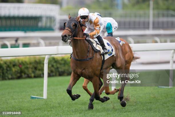 Jockey Silvestre De Sousa riding Wishful Thinker wins the Race 1 Flamingo Flower Handicap at Sha Tin Racecourse on March 10, 2019 in Hong Kong.