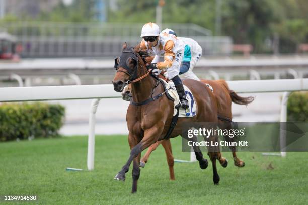 Jockey Silvestre De Sousa riding Wishful Thinker wins the Race 1 Flamingo Flower Handicap at Sha Tin Racecourse on March 10, 2019 in Hong Kong.