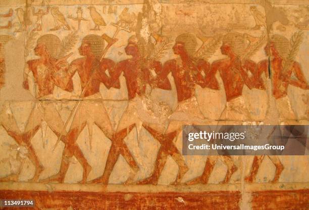 Relief showing members of Queen Hatshepsut's trading expedition to the mysterious 'Land of Punt' from this pharaoh's elegant mortuary temple at Deir...
