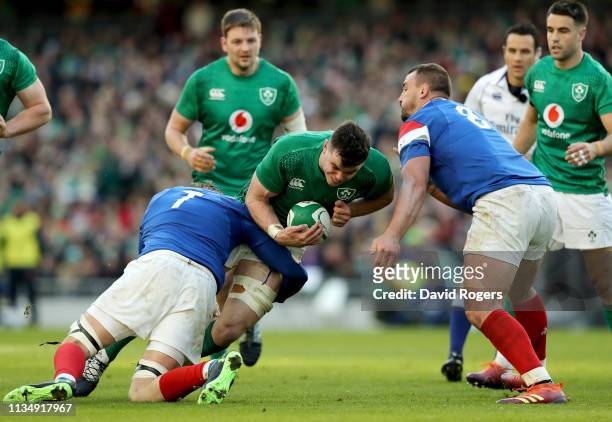 James Ryan of Ireland is tackled by Arthur Iturria and Louis Picamoles of France during the Guinness Six Nations match between Ireland and France at...