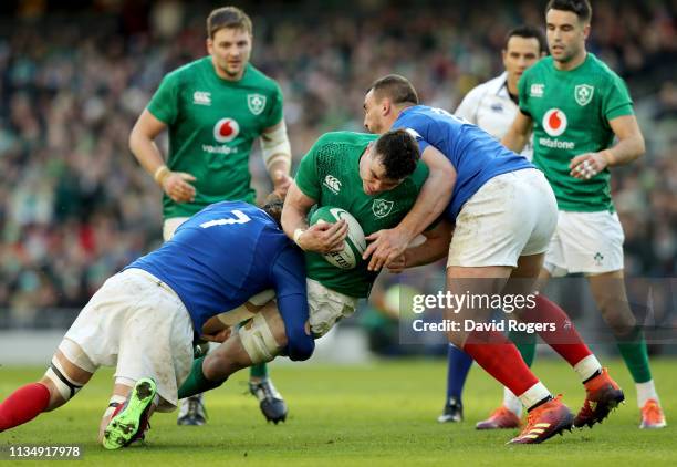 James Ryan of Ireland is tackled by Arthur Iturria and Louis Picamoles of France during the Guinness Six Nations match between Ireland and France at...