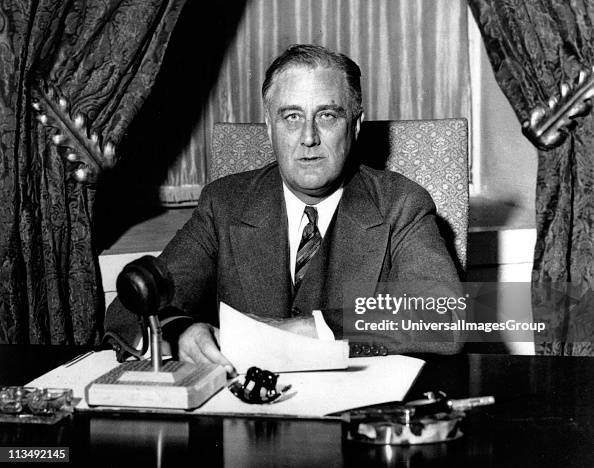 Franklin Delano Roosevelt (1882-1945), 32nd President of the United States of America 1933-1945, giving one of his 'fireside' broadcasts to the American nation during.