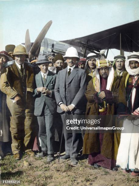 On the airfield at Amman, Jordan, April 1921: T E Lawrence, Sir Herbert Samuel , Emir Abdullah. Woman far left, possibly Gertrude Bell. Sheik Majid...
