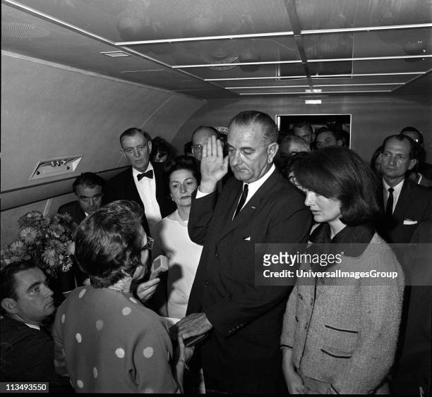 In the aftermath of the assasination of US President John F. Kennedy, American politician and Vice-President Lyndon Baines Johnson takes the oath of...