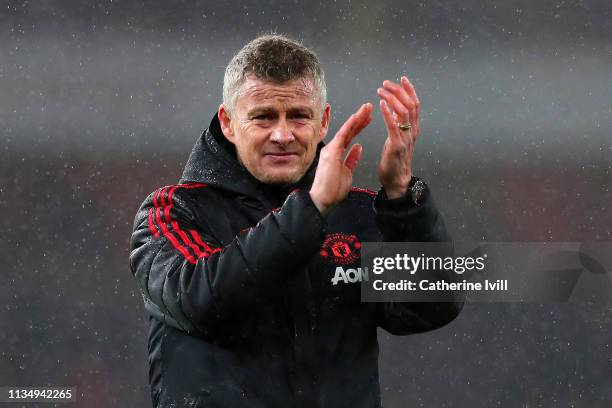 Ole Gunnar Solskjaer, Interim Manager of Manchester United acknowledges the fans following the Premier League match between Arsenal FC and Manchester...