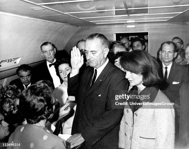 In the aftermath of the assasination of US President John F. Kennedy, American politician and Vice-President Lyndon Baines Johnson takes the oath of...