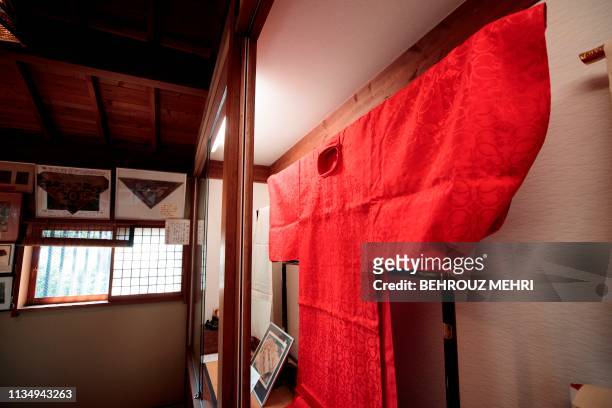 This picture taken on March 2, 2019 shows a kimono, that was worn by a Japanese official during the ethronement ceremony of late Emperor Taisho, at...