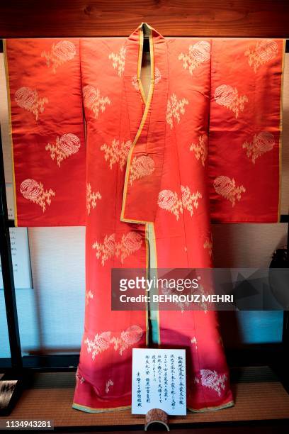 This picture taken on March 2, 2019 shows a kimono that was worn by a court lady during an Imperial ceremony, at the Kimono Museum in Ome, Tokyo...