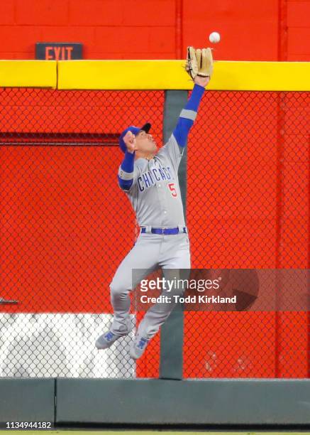 Albert Almora Jr. #5 of the Chicago Cubs makes a leaping catch in the seventh inning of an MLB game against the Atlanta Braves at SunTrust Park on...
