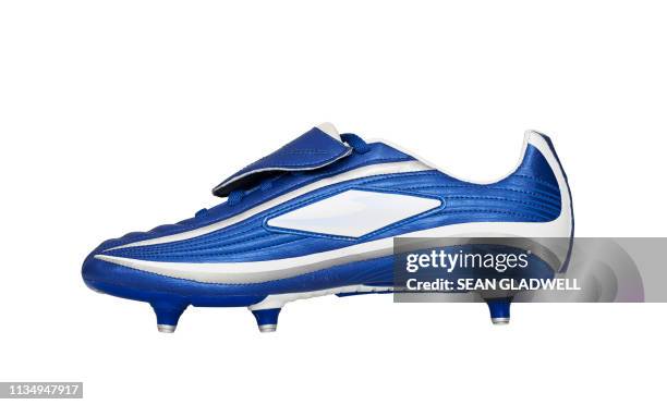 side view of football boot - blue boot fotografías e imágenes de stock