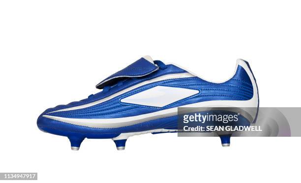 side view of football boot - studded footwear stock pictures, royalty-free photos & images
