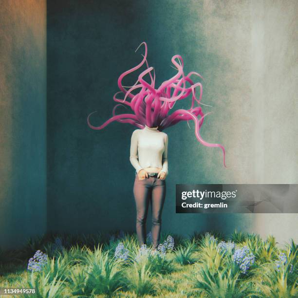 surreal woman standing in concrete cube - alien tentacle stock pictures, royalty-free photos & images