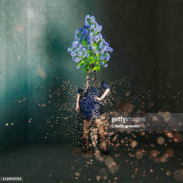 surreal exploding woman standing in concrete cube - rubble explosion stock pictures, royalty-free photos & images