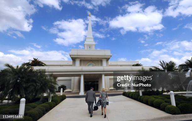 People enter the Orlando, Florida Temple of the Church of Jesus Christ of Latter-Day Saints on April 4 the day the Mormon church announced it was...