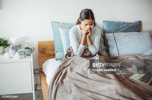 flu attack - blowing nose stock pictures, royalty-free photos & images