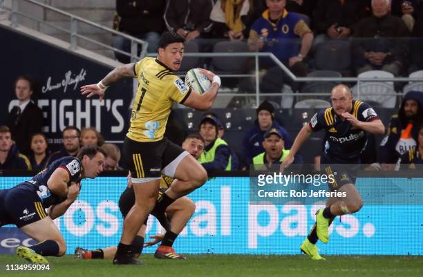 Ben Lam of the Hurricanes on the attack during the round 8 Super Rugby match between the Highlanders and Hurricanes at Forsyth Barr Stadium on April...