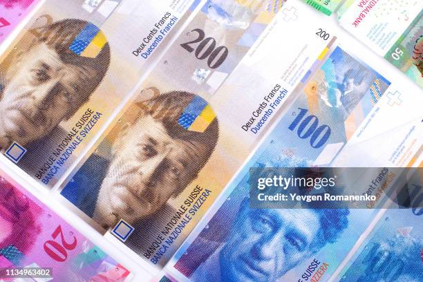 banknotes of swiss francs currency as background - franken stock-fotos und bilder