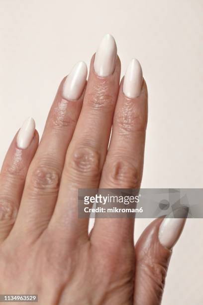 close-up of woman fingers with nail art, baby-boomer-french-manicure - acrylic nails stock pictures, royalty-free photos & images