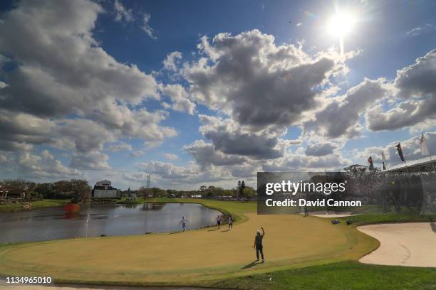 Graduated neutral density filter used on this image; Francesco Molinari celebrates holing a long putt for birdie on the par 4, 18th hole as his...