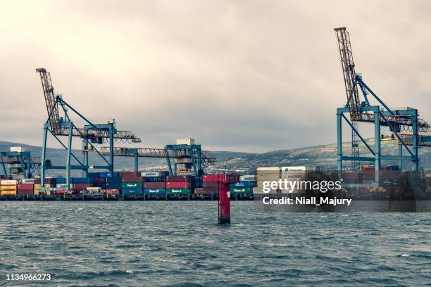 the shipping container dock at belfast harbour - belfast dock stock pictures, royalty-free photos & images