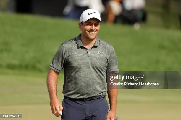 Francesco Molinari of Italy smiles after making a putt for birdie on the 18th hole during the final round of the Arnold Palmer Invitational Presented...