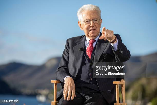 Mario Monti, former Italian prime minister, gestures while speaking during a Bloomberg Television interview at the 30th edition of "The Outlook for...