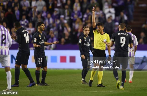 Casemiro of Real Madrid is shown a red card by referee Jesus Gil Manzano during the La Liga match between Real Valladolid CF and Real Madrid CF at...