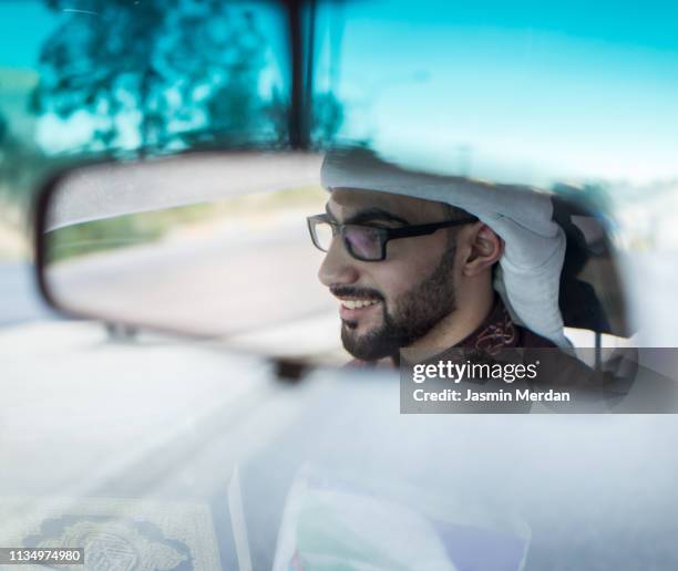 middle eastern driver - arab driving stock-fotos und bilder