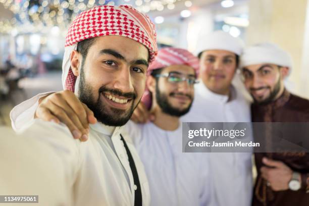 selfie of cheerful group of middle eastern people - amman people stock pictures, royalty-free photos & images