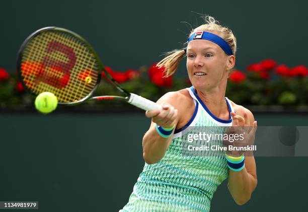 Kiki Bertens of the Netherlands plays a forehand against Johanna Konta of Great Britain during their women's singles third round match on day seven...