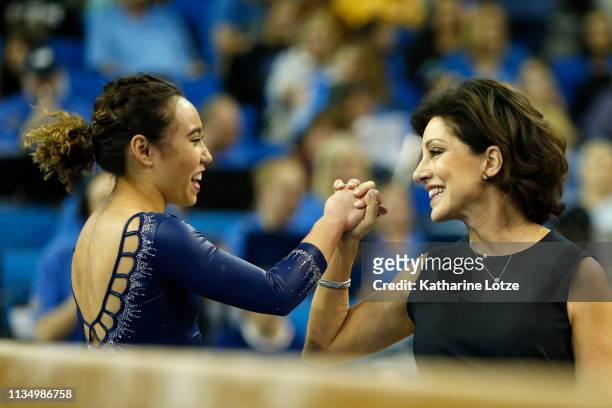 Katelyn Ohashi and coach Valorie Kondos-Field share a moment during a meet against Stanford at Pauley Pavilion on March 10, 2019 in Los Angeles,...