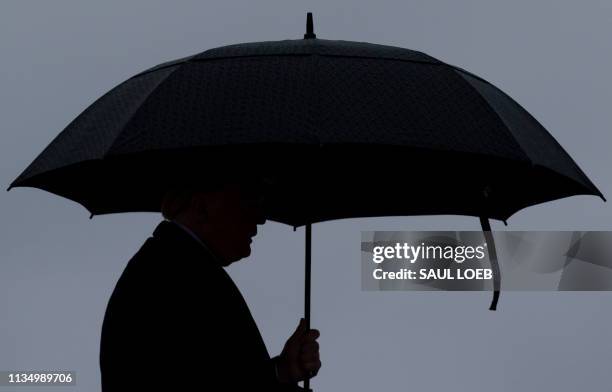 President Donald Trump boards Air Force One prior to departure from Joint Base Andrews in Maryland, April 5, 2019. - Trump is traveling to California...