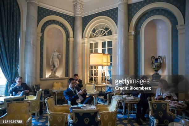 Attendees sit inside the hotel Villa d'Este during a break in sessions at the 30th edition of "The Outlook for the Economy and Finance," workshop...