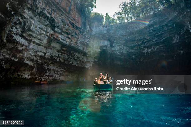 Sept 2018 - Cefalonia, Greece: Tourists view caves by boat on September 15, 2018 in Cefalonia, Greece.