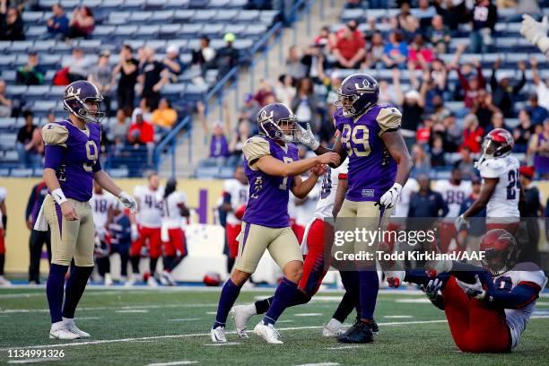 Younghoe Koo of Atlanta Legends is congratulated by his teammates Cameron Nizialek and Keith Towbridge after his 35-yard game-winning field goal to...