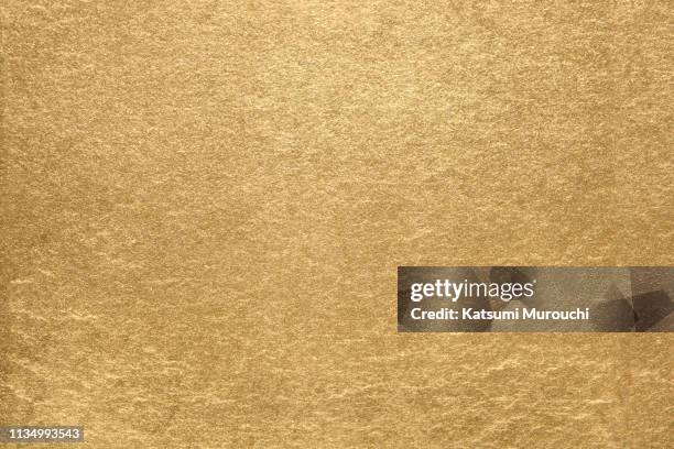 gold leaf texture background - gold foil stock-fotos und bilder