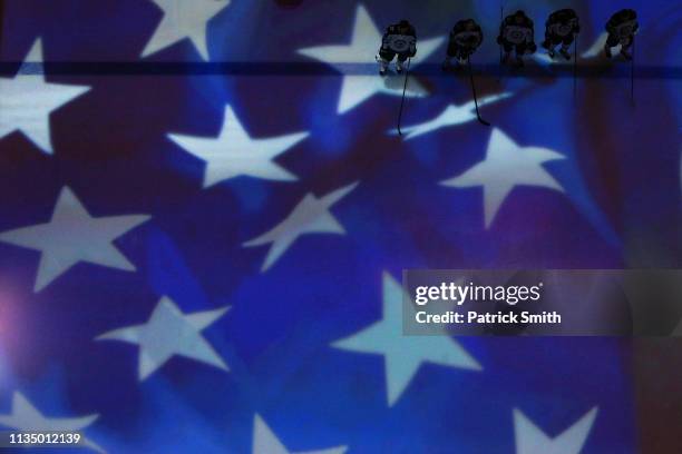 The Winnipeg Jets look on during the U.S. National Anthem before playing against the Washington Capitals during at Capital One Arena on March 10,...