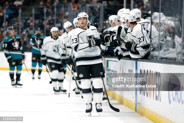 Dustin Brown of the Los Angeles Kings fist-bumps teammates after scoring the first goal for the Los Angeles Kings during the first period against the...