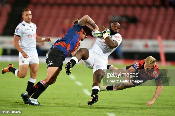 Tendai Mtawarira of the Cell C Sharks is tackled by Malcolm Marx and Tyrone Green of the Emirates Lions during the Super Rugby match between Emirates...