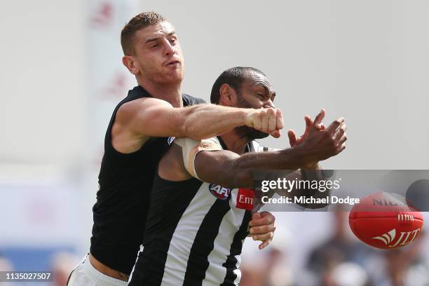 Liam Jones of the Blues punches the ball from Travis Varcoe of the Magpies during the 2019 JLT Community Series match between the Collingwood Magpies...