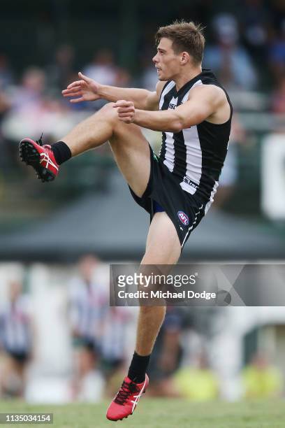 Josh Thomas of the Magpies kicks a goal in the dying stages during the 2019 JLT Community Series match between the Collingwood Magpies and the...