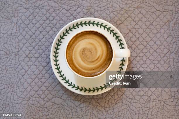 directly above view of latte milk, coffee on table - cappuccino top view stock-fotos und bilder