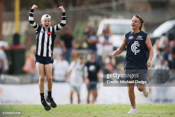 Magpies fans beats a Blues fan to the middle of the ground after the final siren during the 2019 JLT Community Series match between the Collingwood...