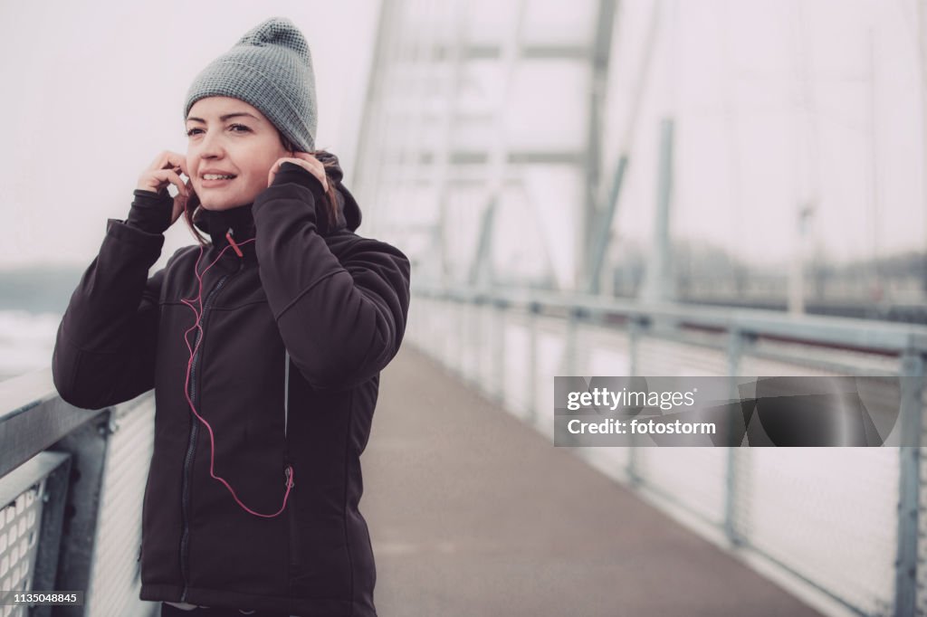 Woman listening to music during an outdoor training