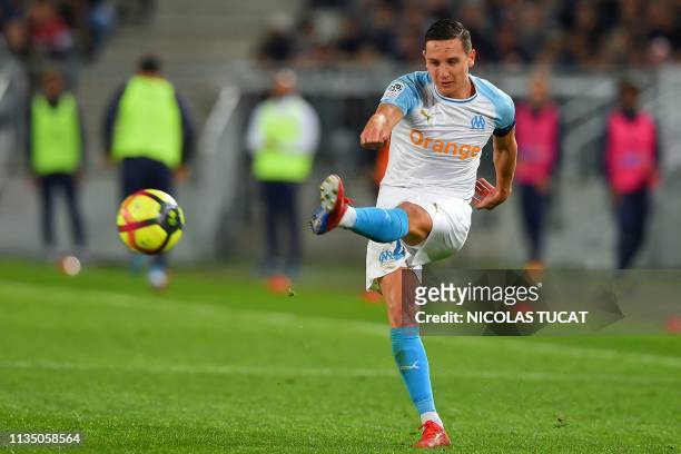 Marseille's French midfielder Florian Thauvin kicks the ball during the French Ligue 1 football match between FC Girondins de Bordeaux and Olympique...