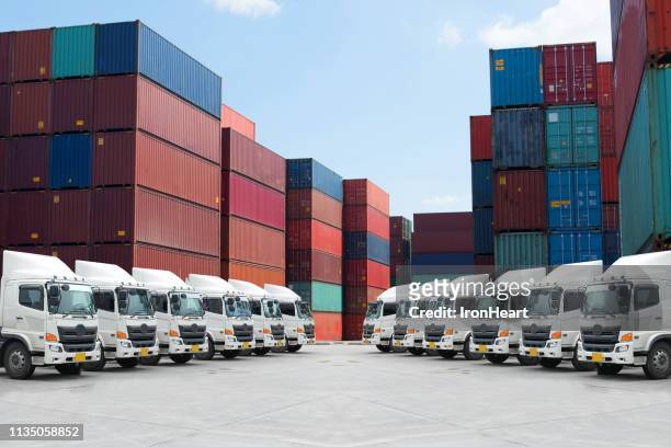 haulage truck fleet with container depot - convoy of traffic stock pictures, royalty-free photos & images