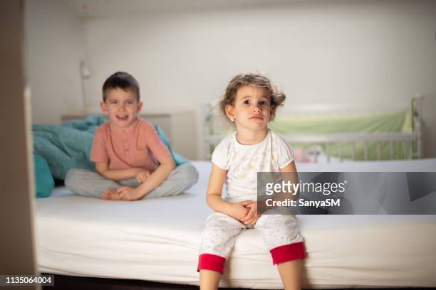 little girl crying in bedroom - crying sibling stock pictures, royalty-free photos & images