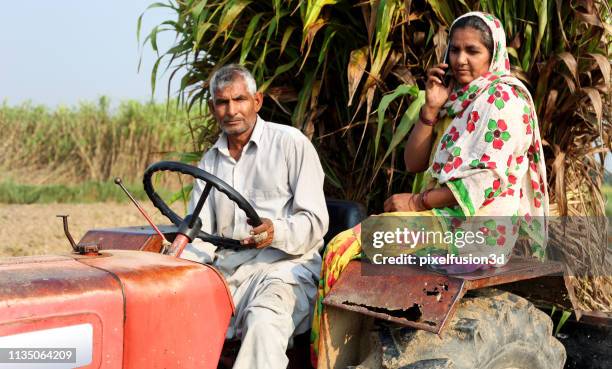 farmer riding tractor - haryana stock pictures, royalty-free photos & images