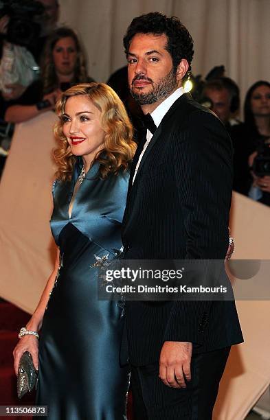 Madonna and Guy Oseary attend the "Alexander McQueen: Savage Beauty" Costume Institute Gala at The Metropolitan Museum of Art on May 2, 2011 in New...